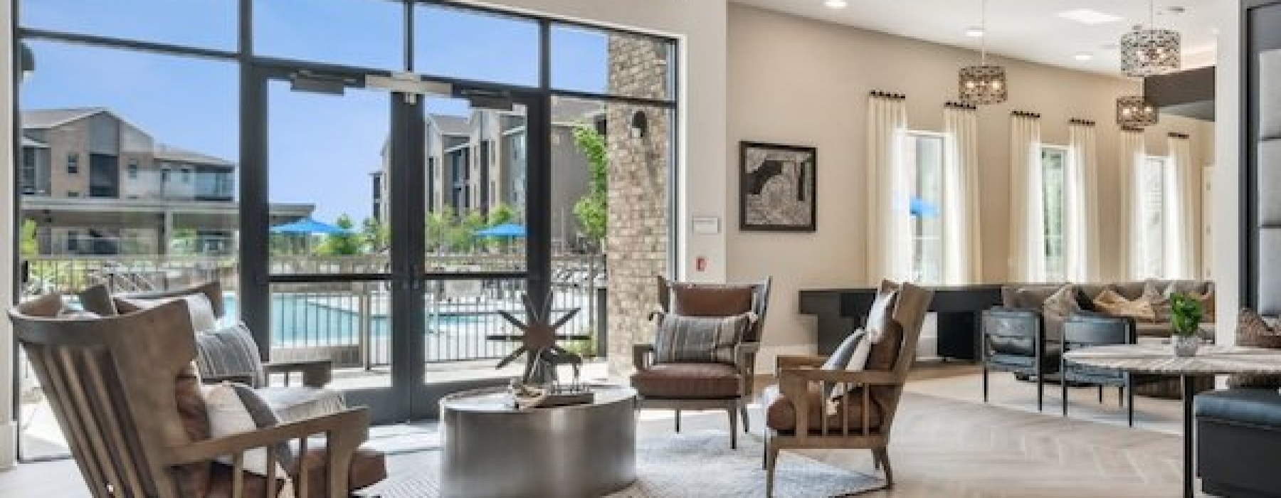 a lobby with chairs and windows